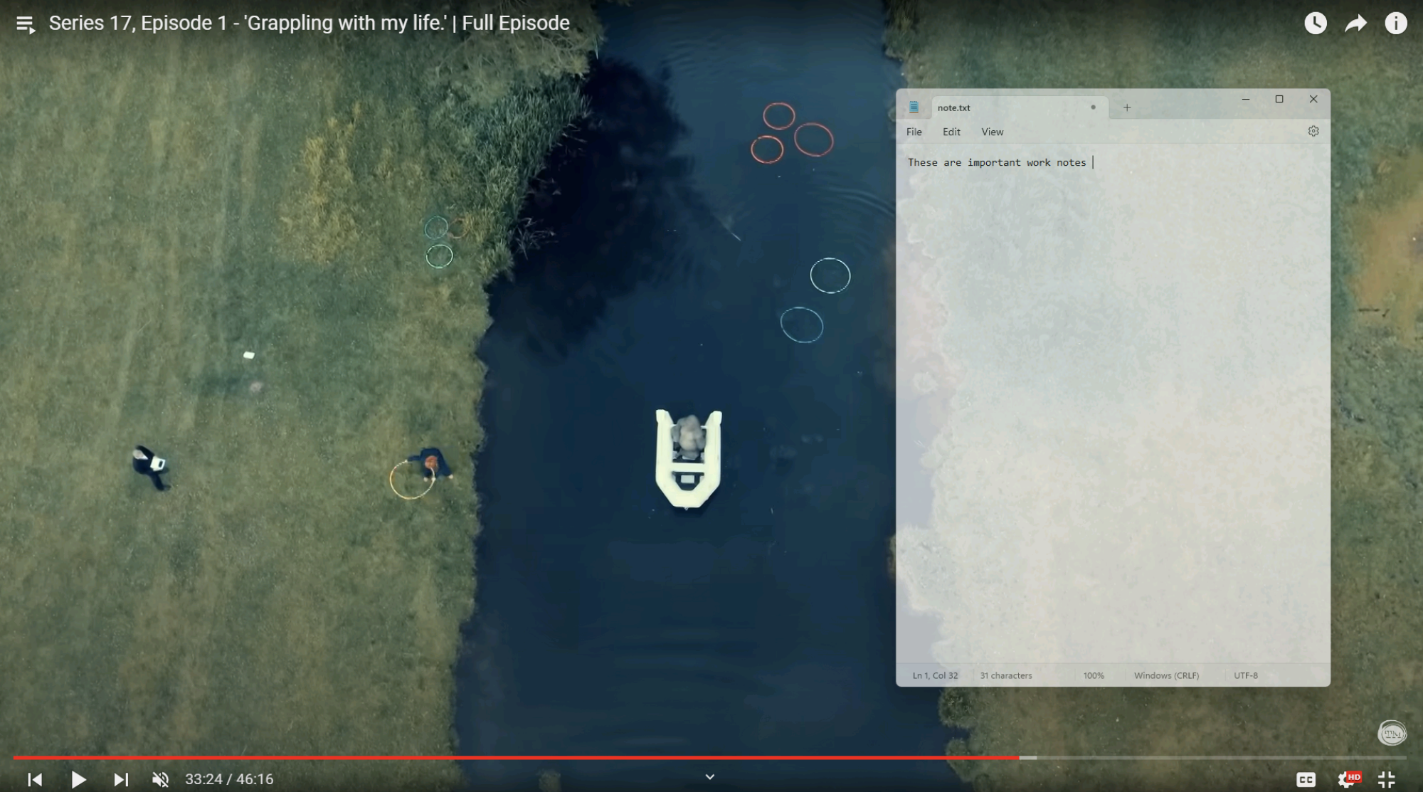 An overhead view of a gorilla in a boat on an English river is shown—a clip from the current season of Taskmaster. A transparent Notepad window, shown over it, says "These are important work notes."